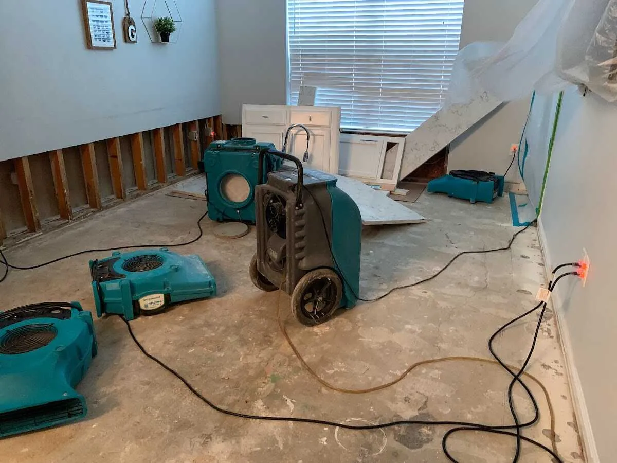 Dehumidifier in flood-cut room for Water Damage Restoration in Lawrence